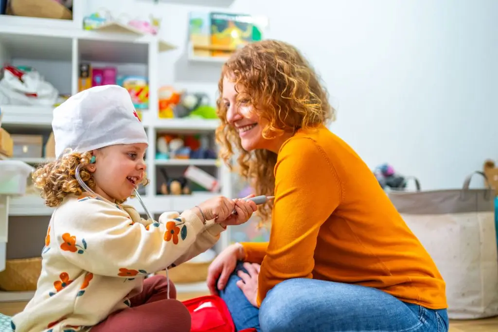 Mother role-playing with her daughter.