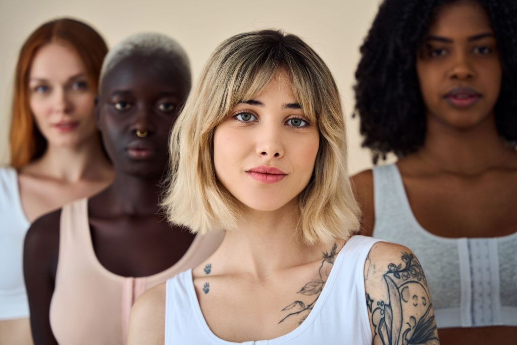 Gen Z girls with good mental health looking at the camera.