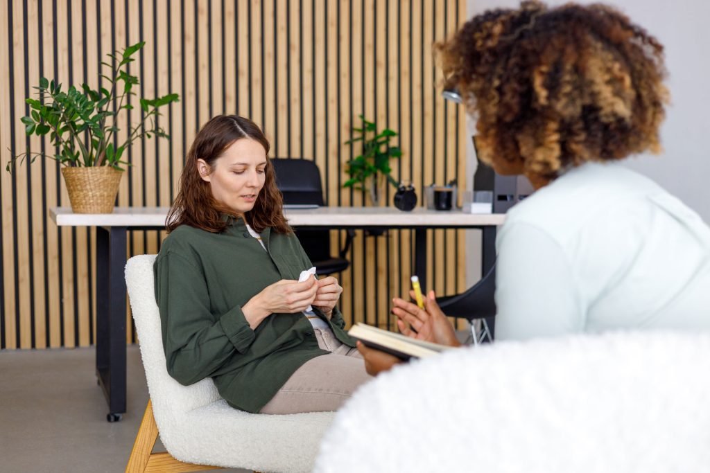 Female therapist talking to a patient.