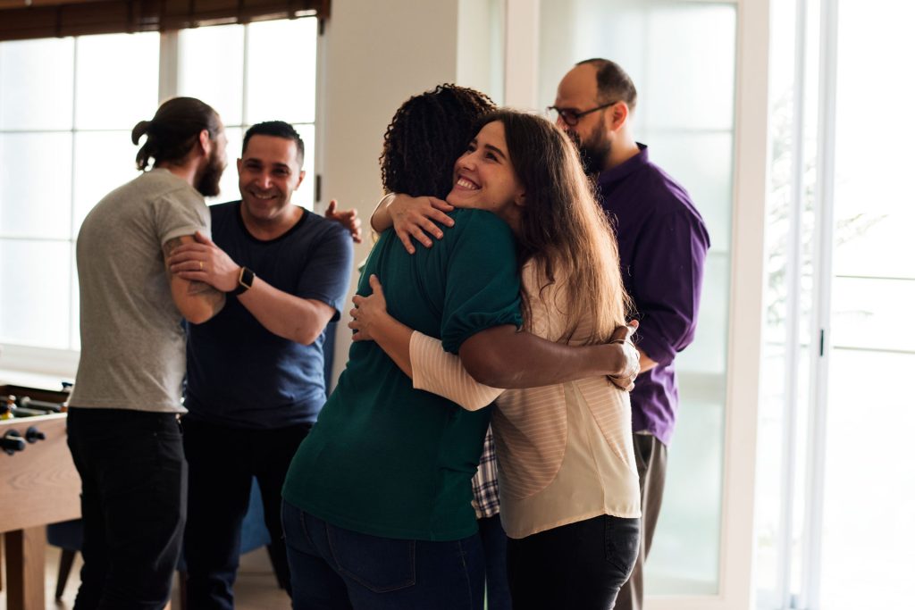 Friends hugging each other.