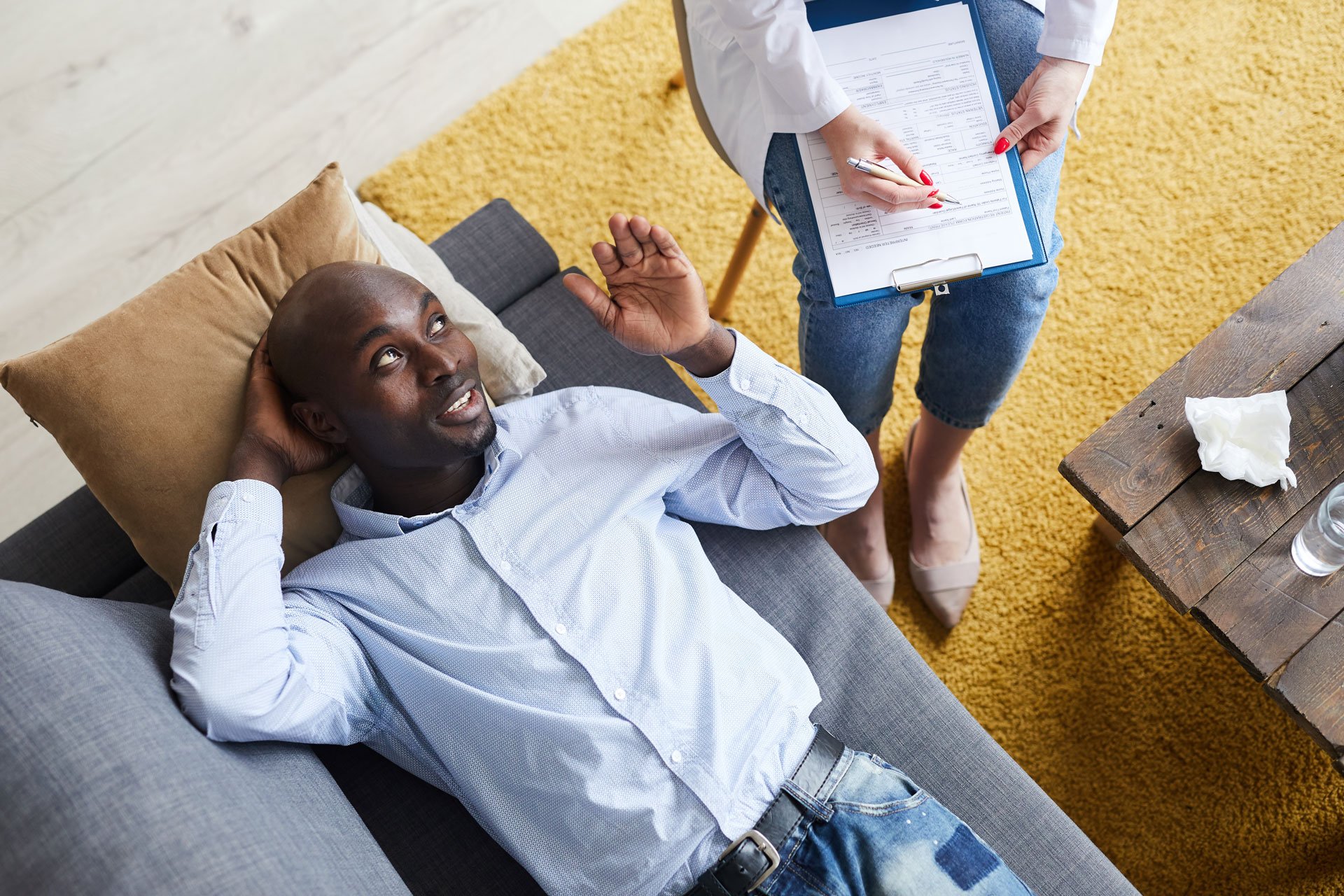 Man sharing experience with the therapist.