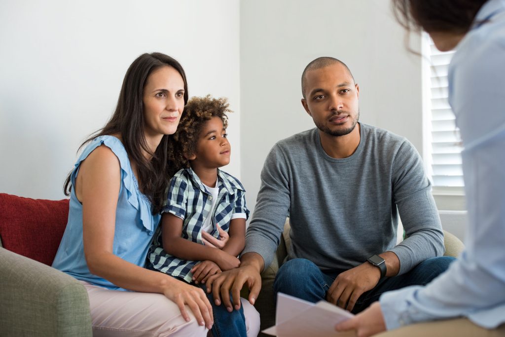 Family talking to a therapist.