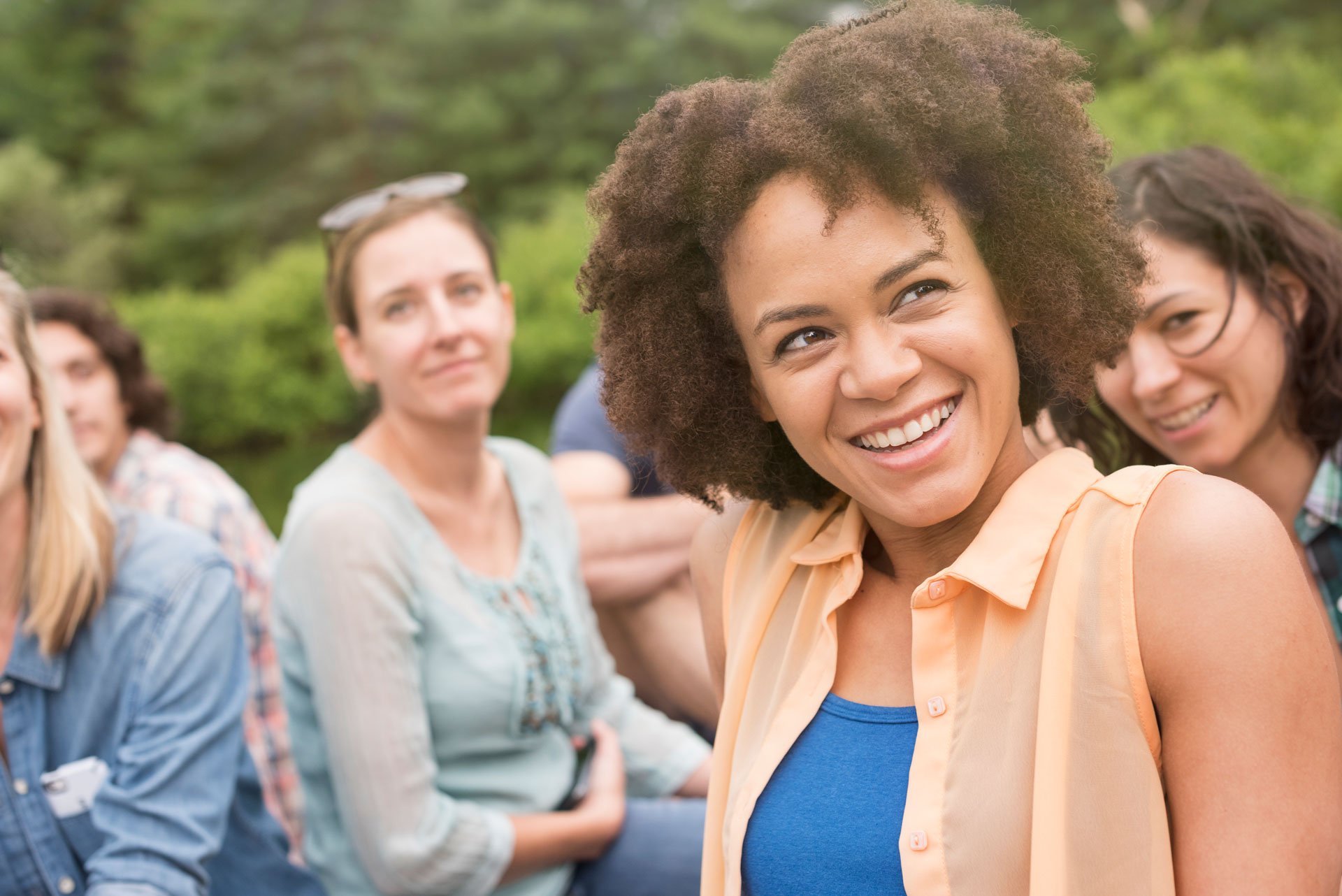 a woman in group outdoor.