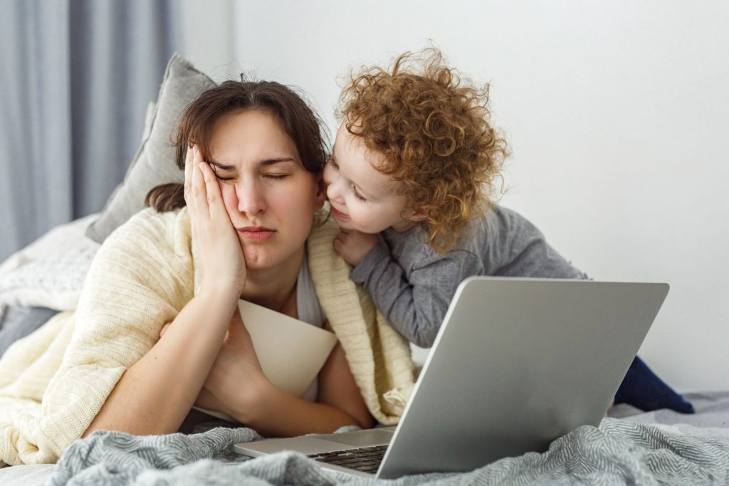 Tired mom with her toddler.