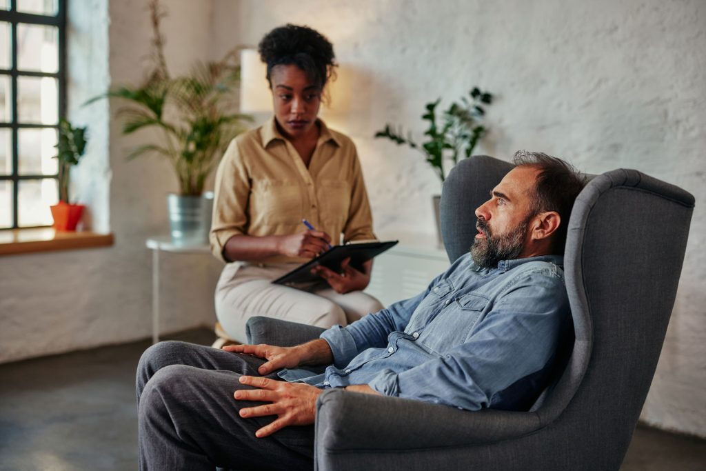 Female therapist listening to her patient.