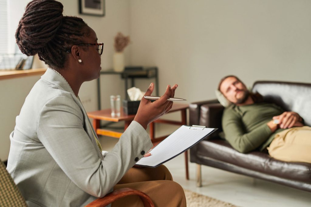 Psychologist talking to a patient.