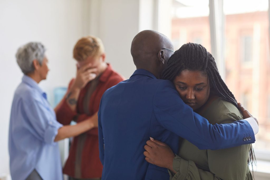 Emotionally supporting people suffering from grief.
