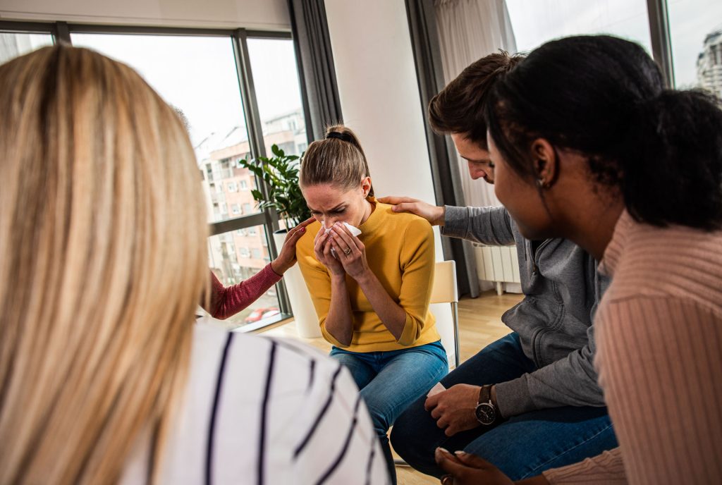 Diverse group of people having a group therapy.