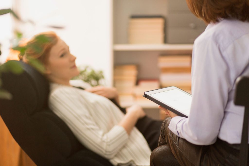 Psychiatrist interviewing patient.