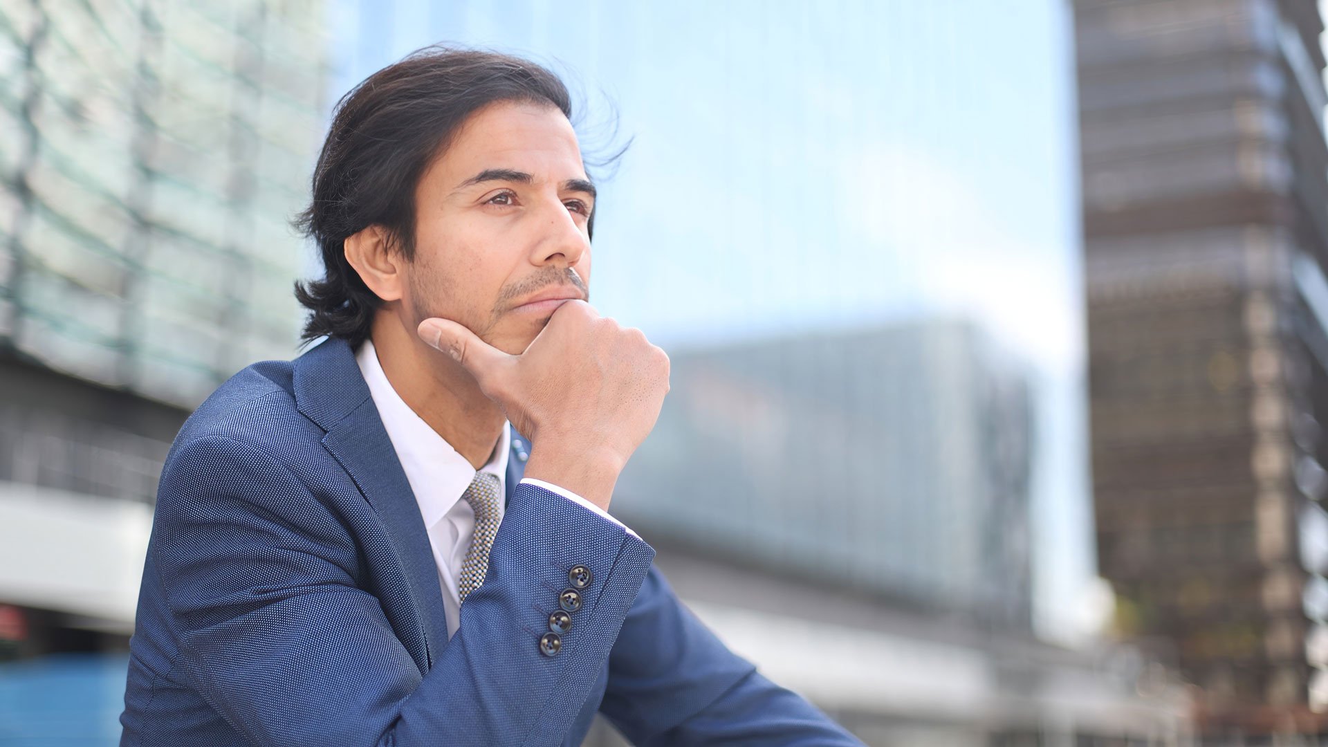 Businessman contemplating.