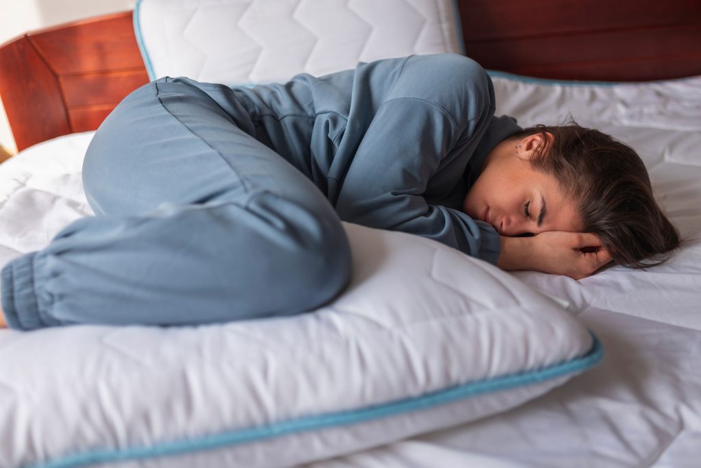 Woman lying in bed.