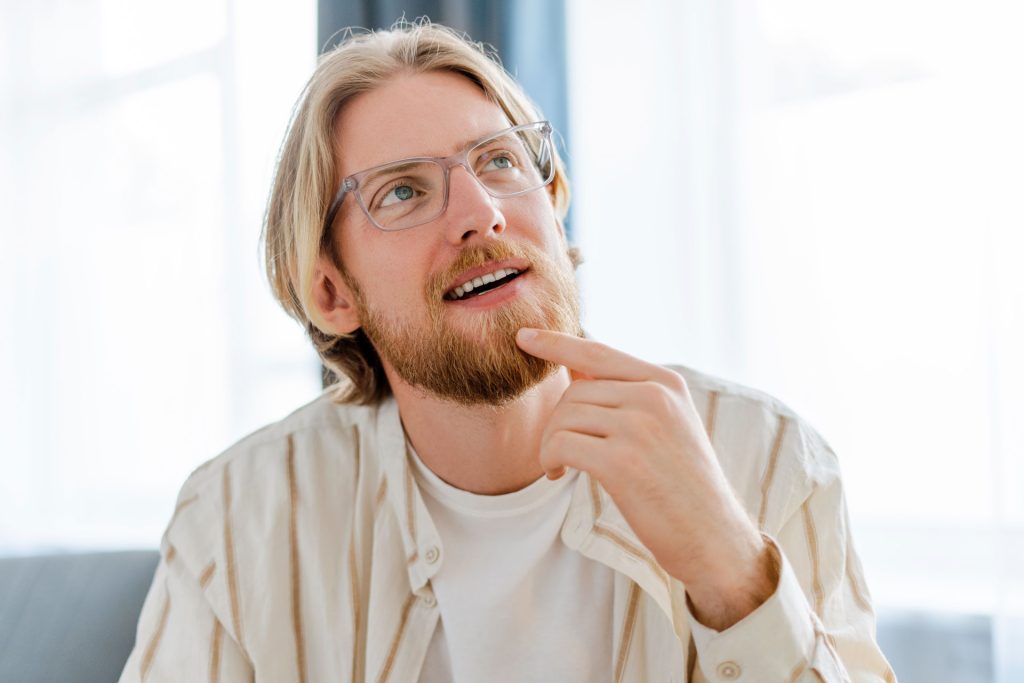 Man thinking and looking up.