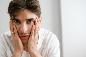 Worried man sitting.