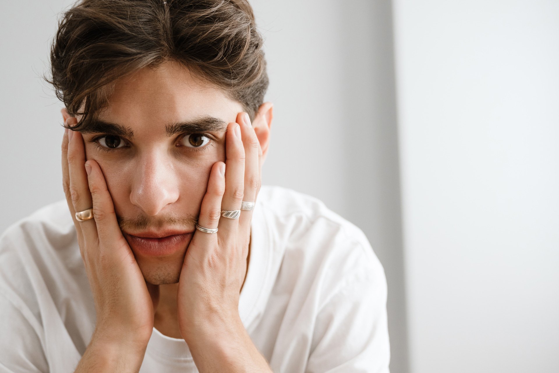 Worried man sitting.