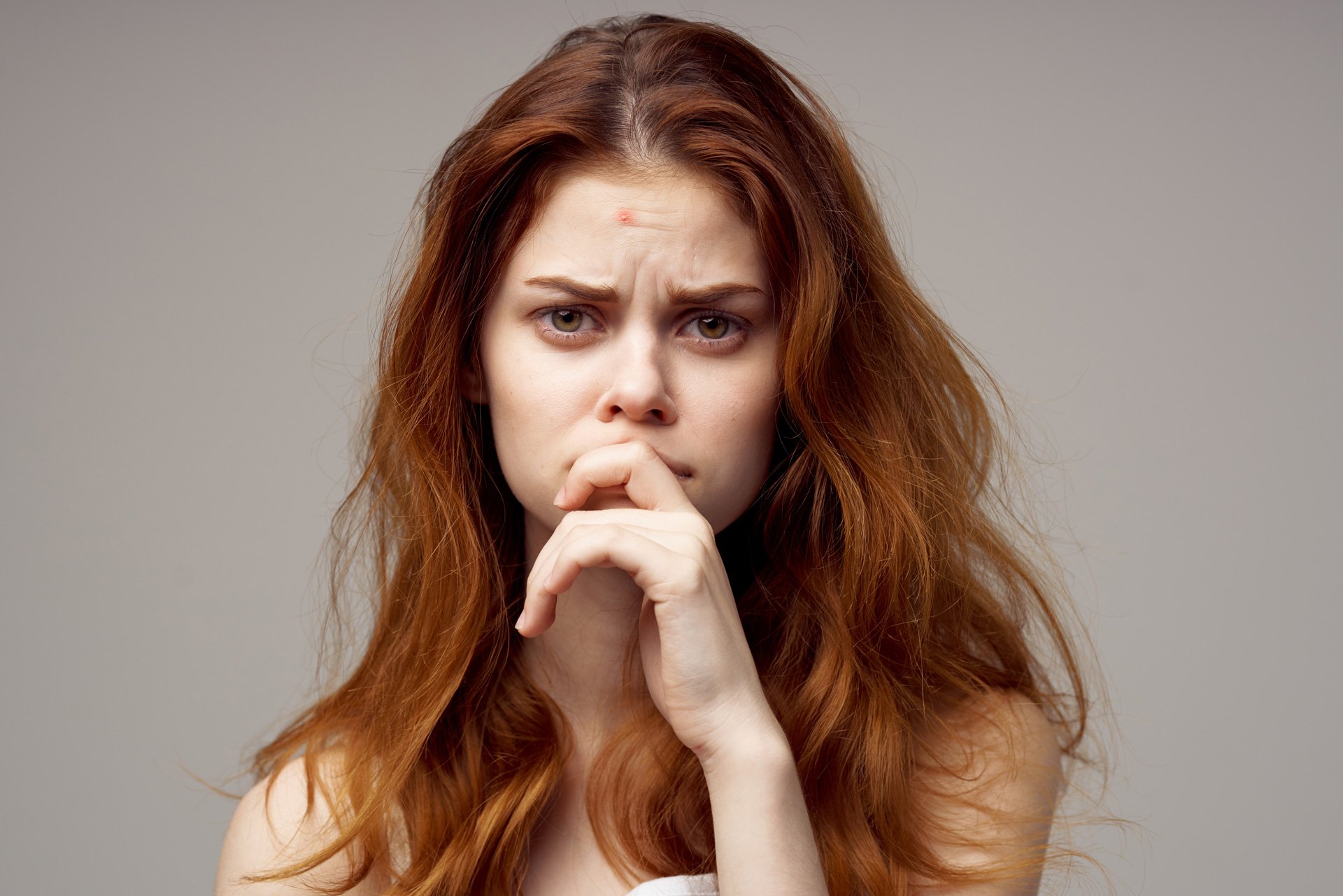 Red haired woman with anxiety.